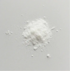 White supplement powder pile on a plain surface, Super Muscles Nutrition product - Creatine Monohydrate Unflavored - Creatine Monohydrate Unflavored - Creatine Monohydrate Unflavored