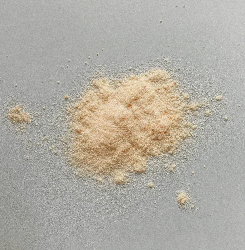 Heap of beige protein powder on a grey background, Super Muscles Nutrition supplement - Creatine Monohydrate Mango Fury - Creatine Monohydrate Mango Fury